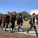 Students from Marjory Stoneman Douglas High School walk out of school March 14, 2018, to honor the memories of the 17 people killed during a mass shooting at the Parkland, Fla., school a month earlier.